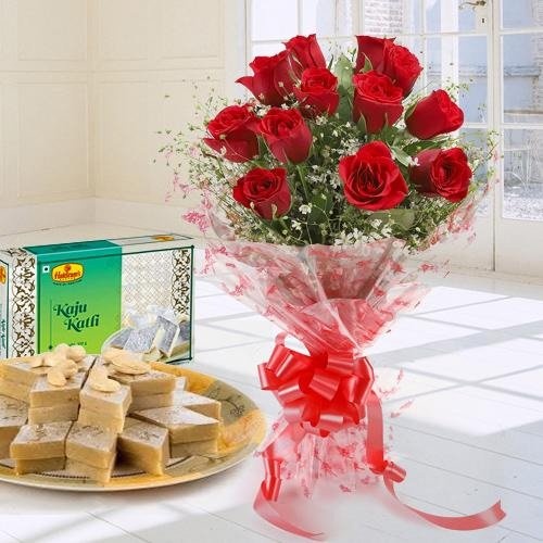 Lovely charming Red Roses combined with mouthwatering Kaju Katli
