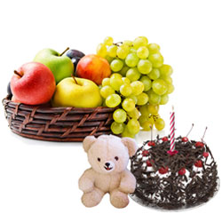 Exclusive Teddy with Candles Fresh Fruits Basket and Black Forest Cake