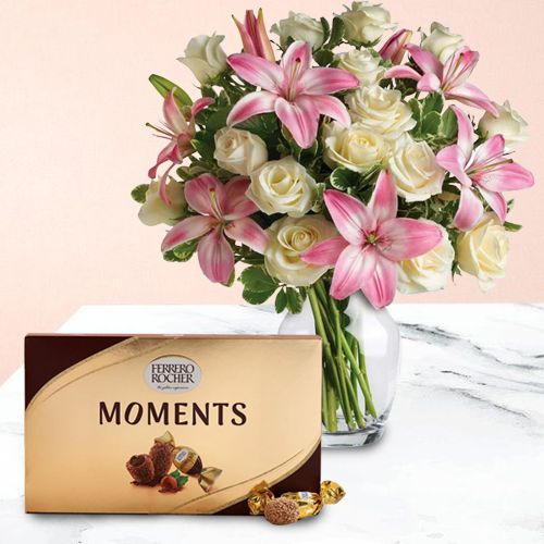 Marvelous Lilies n Roses in Glass Vase with Ferrero Rocher Moments