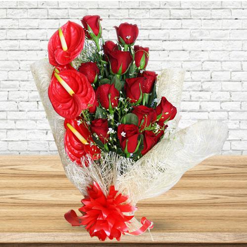 Amusing Red Roses N Anthurium Bouquet Wrapped in Tissue